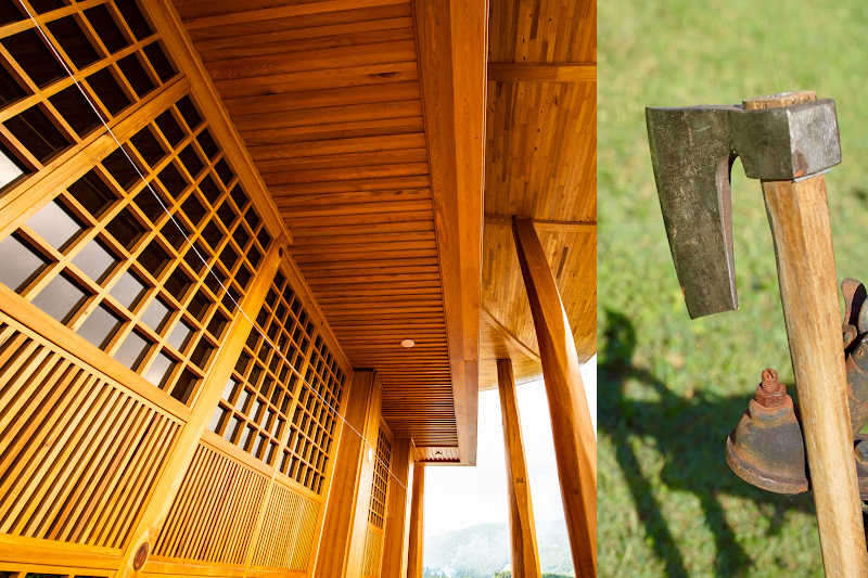 The entrance of a large wooden building in Japan and a Japanese carpenter's axe. 