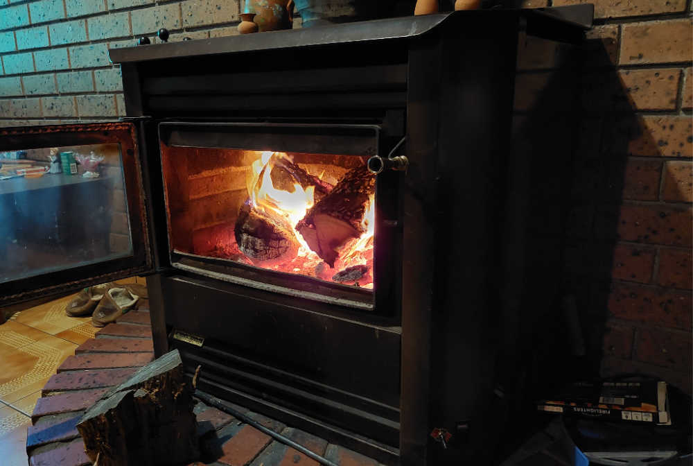 A fireplace burning butternut firewood