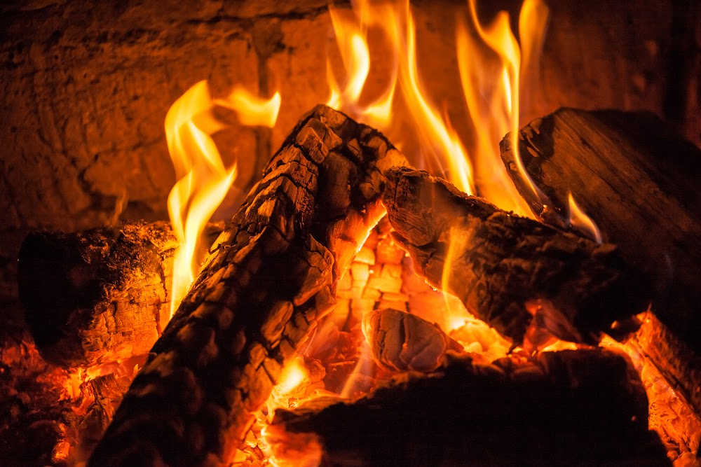 Closeup of a fireplace buring mahogany
