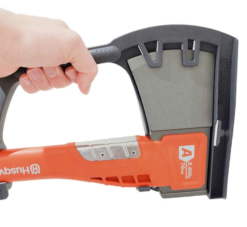 A hand demonstrating the carry handle for the A2400 axe