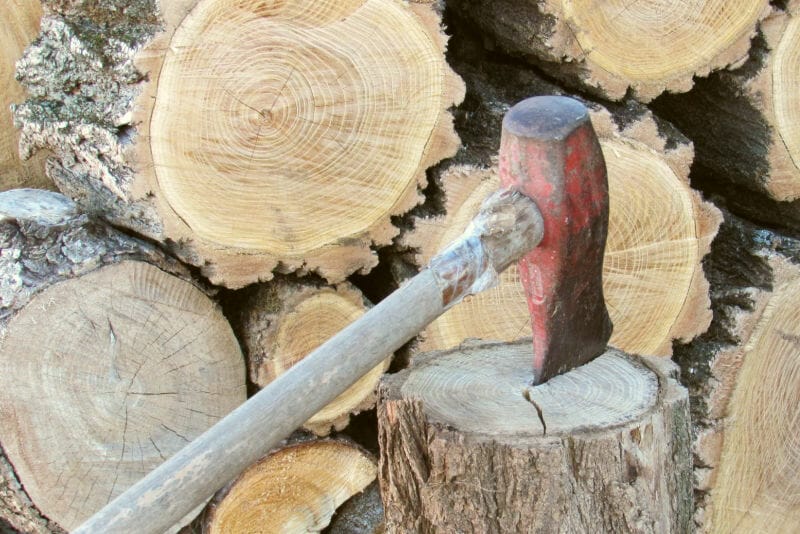 A maul stuck into a round of wood